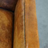 Fauteuil unique en cuir de mouton ancien