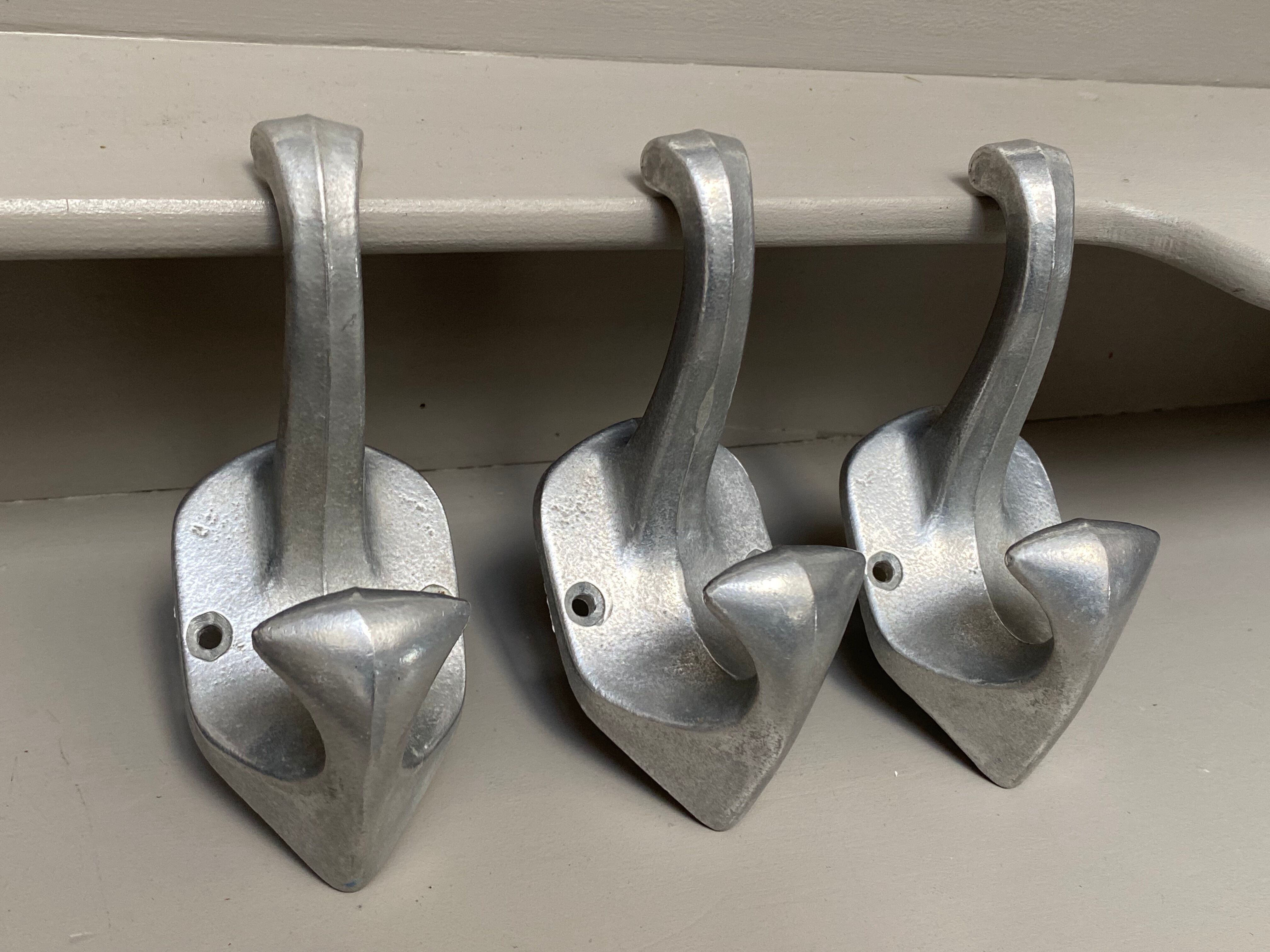 3 cast aluminum hooks