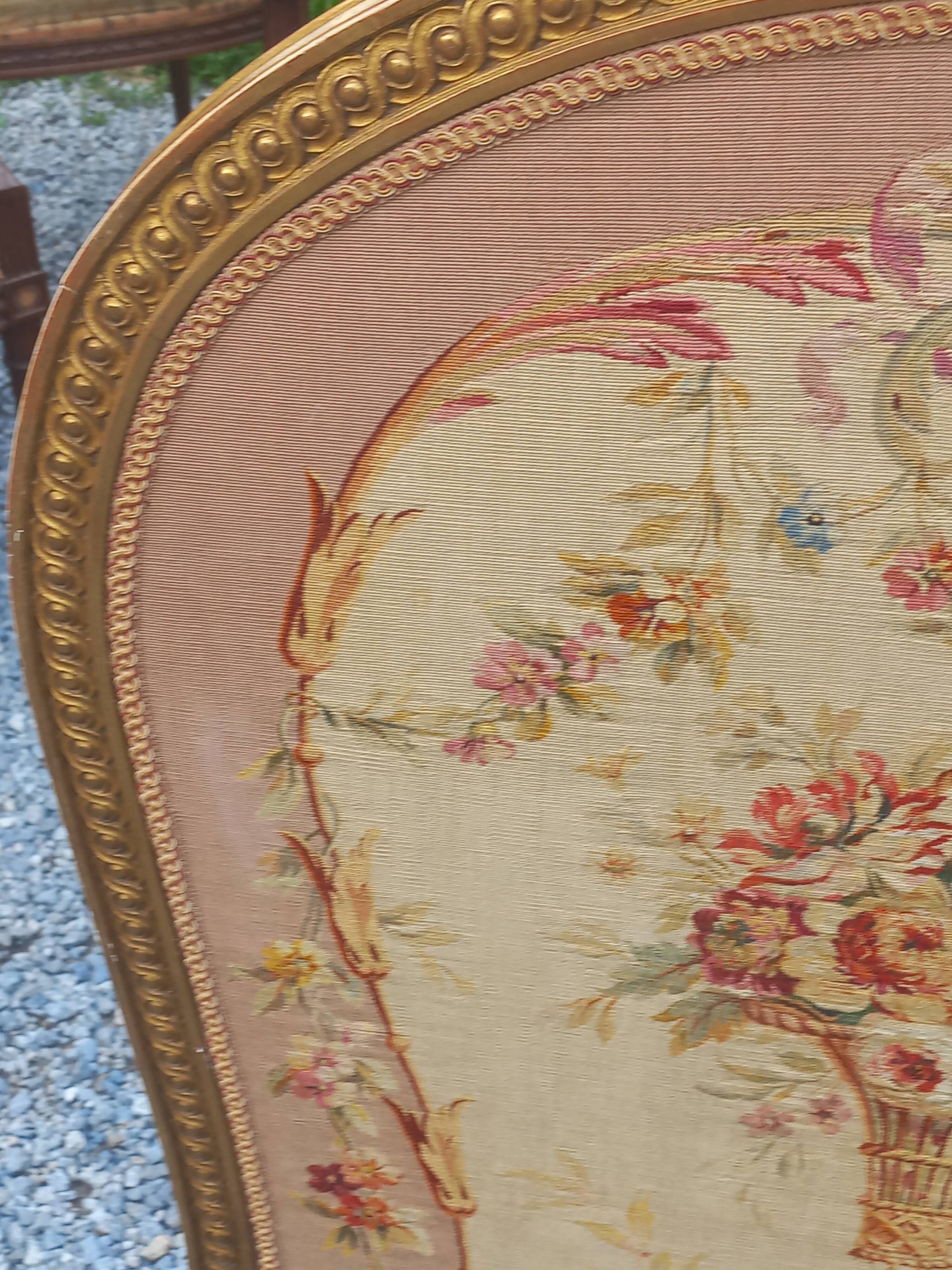 Golden wooden fireplace screen and Aubusson tapestry, 19th century.