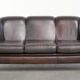 Set of a sheepskin sofa together with its matching club armchair