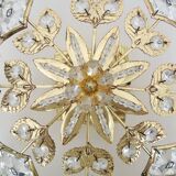 Ancien plafonnier en forme d'étoile à 4 feux en laiton, pampilles en verre. Années 80