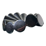 Empty pocket black glazed ceramic ashtray, 1970