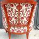 Antique salon with a banquette and Louis XV style bergère chairs.