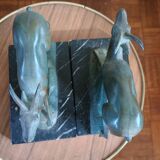 Pair - Chamois metal bookends with green patina & black marble base