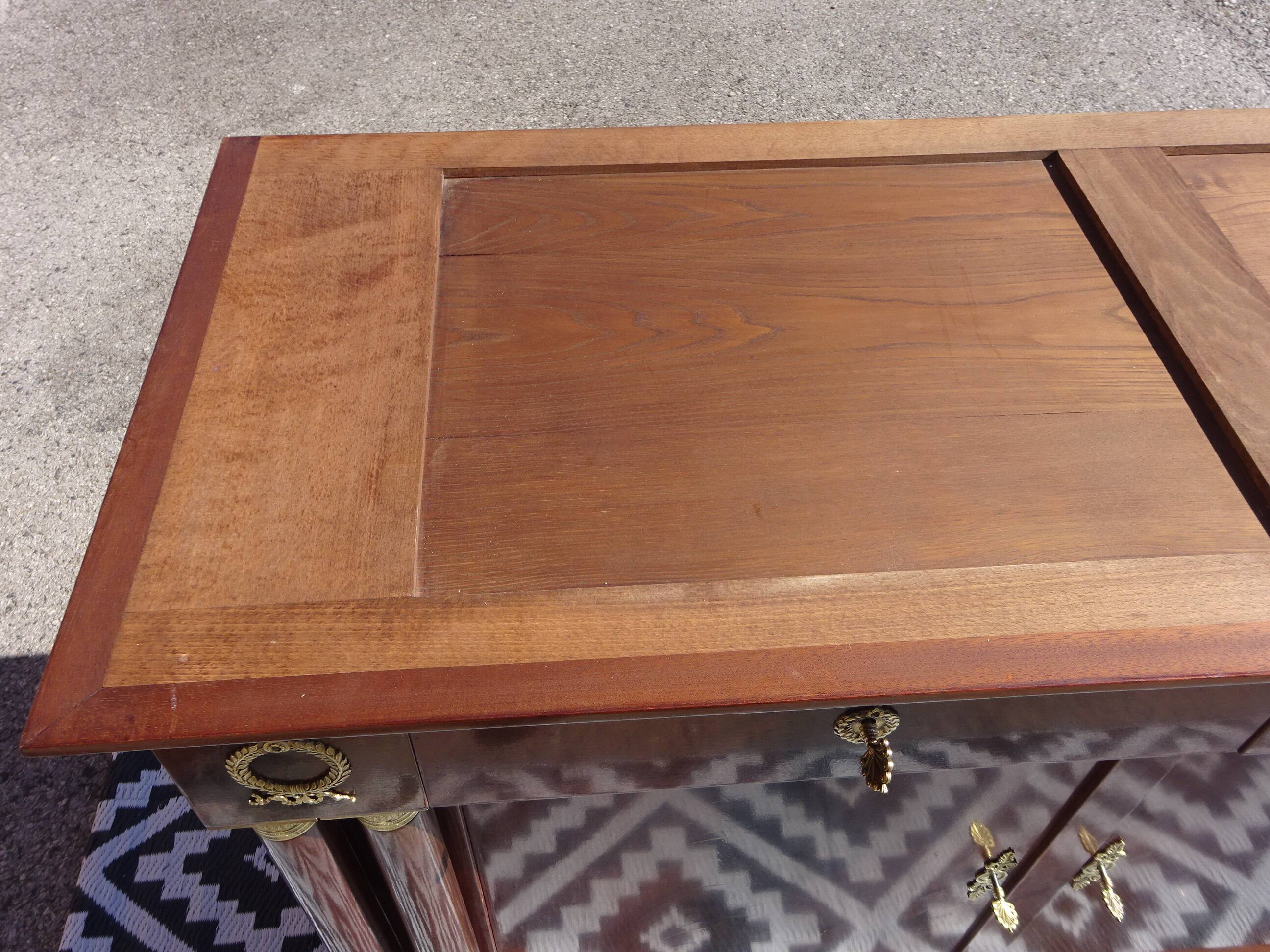 Flamed mahogany enfilade with sea green marble in Empire style.