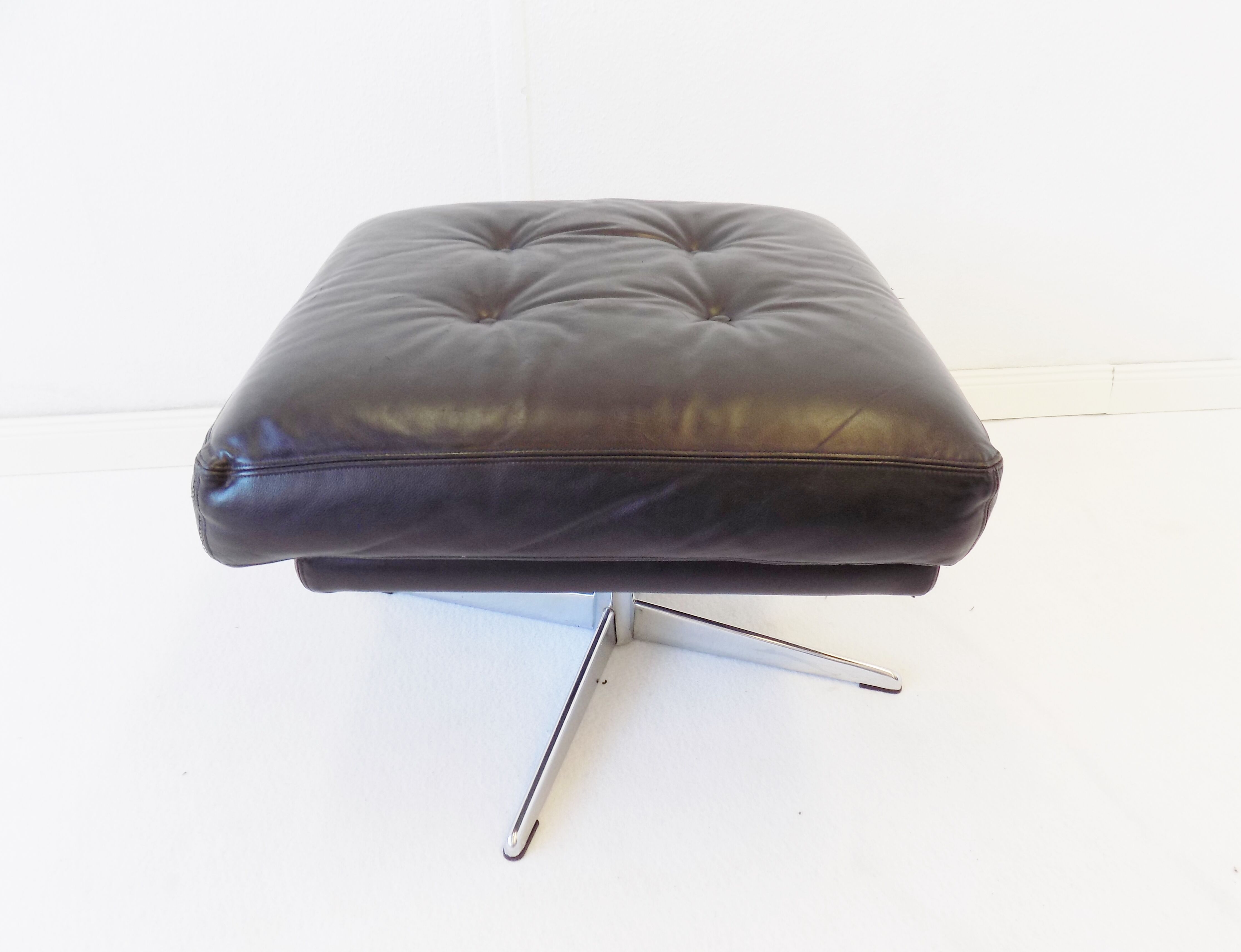 Danish black leather armchair with ottoman 70s