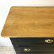 Blackened wooden chiffonnier and varnished top