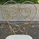 Vintage heart chair from the 1950s Hollywood Regency in gold metal.