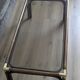 Bamboo coffee table with brass corners and smoked glass