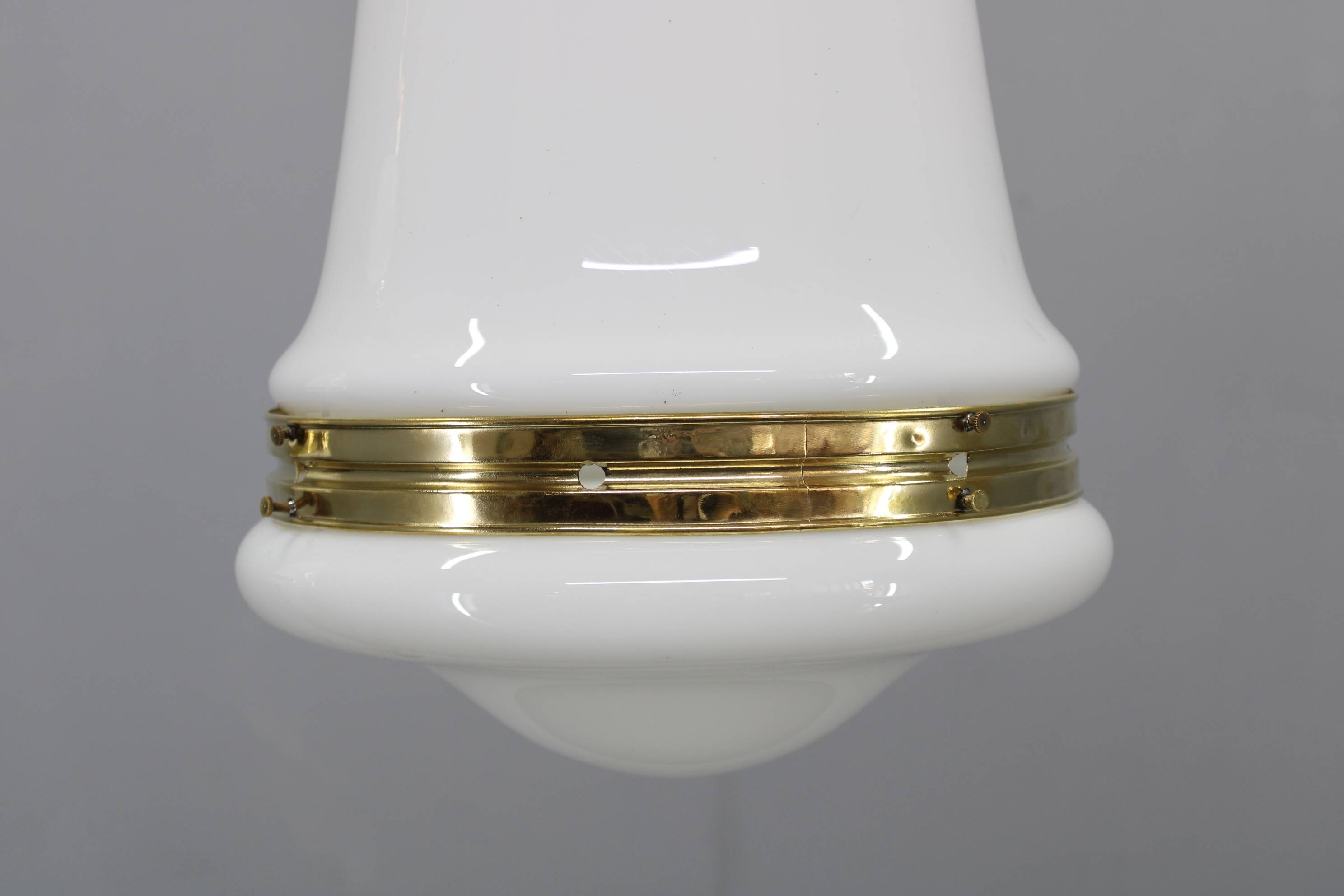 Pair of 1930s Peter Behrens Luzette pendants in opaline glass and brass