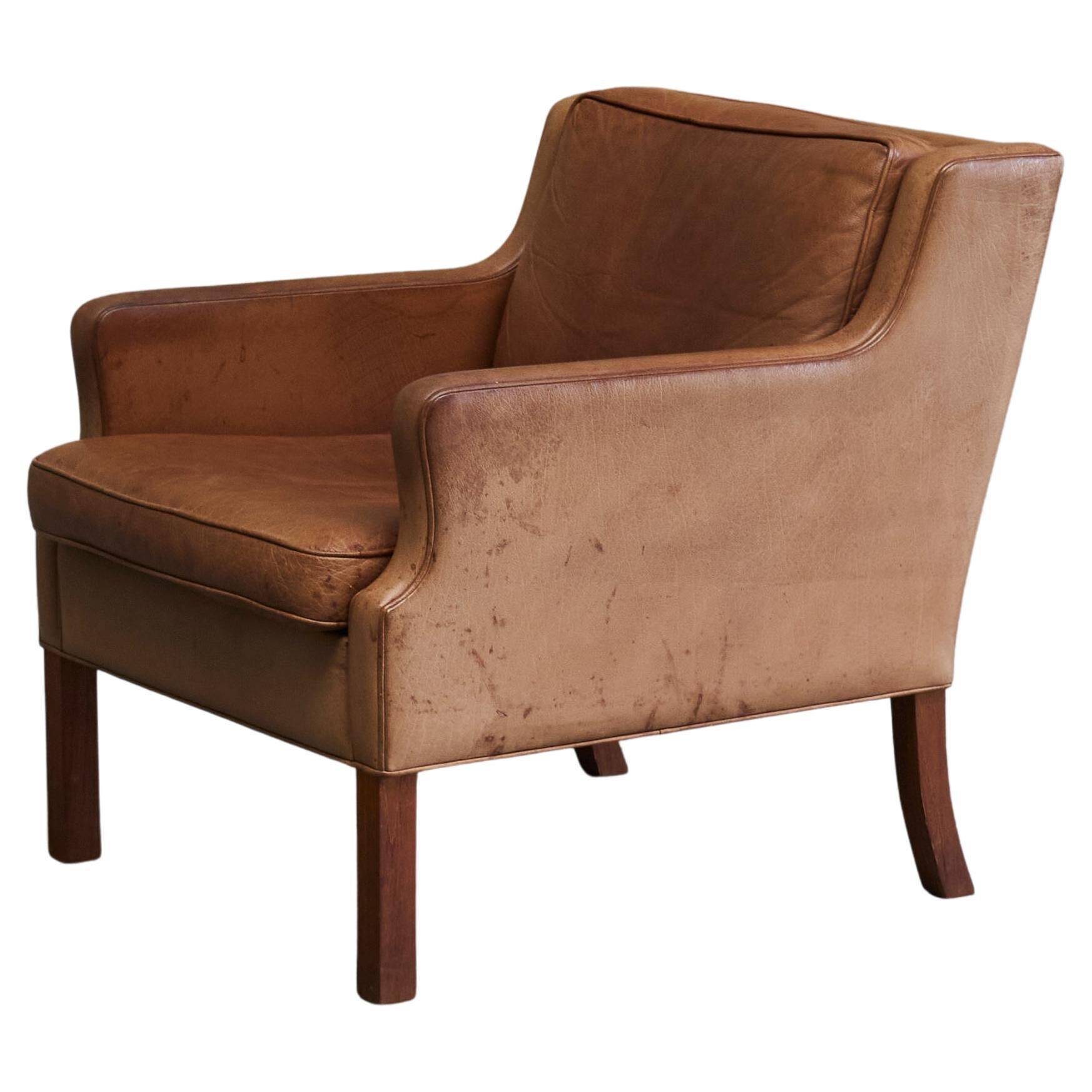 1970s patinated leather Scandinavian lounge chair