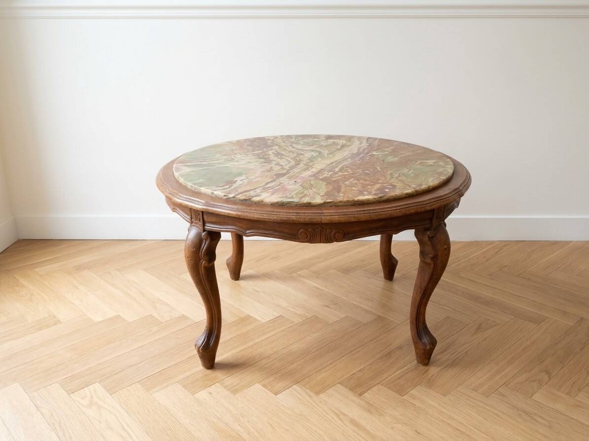 Classic round coffee table in wood with a marble top.