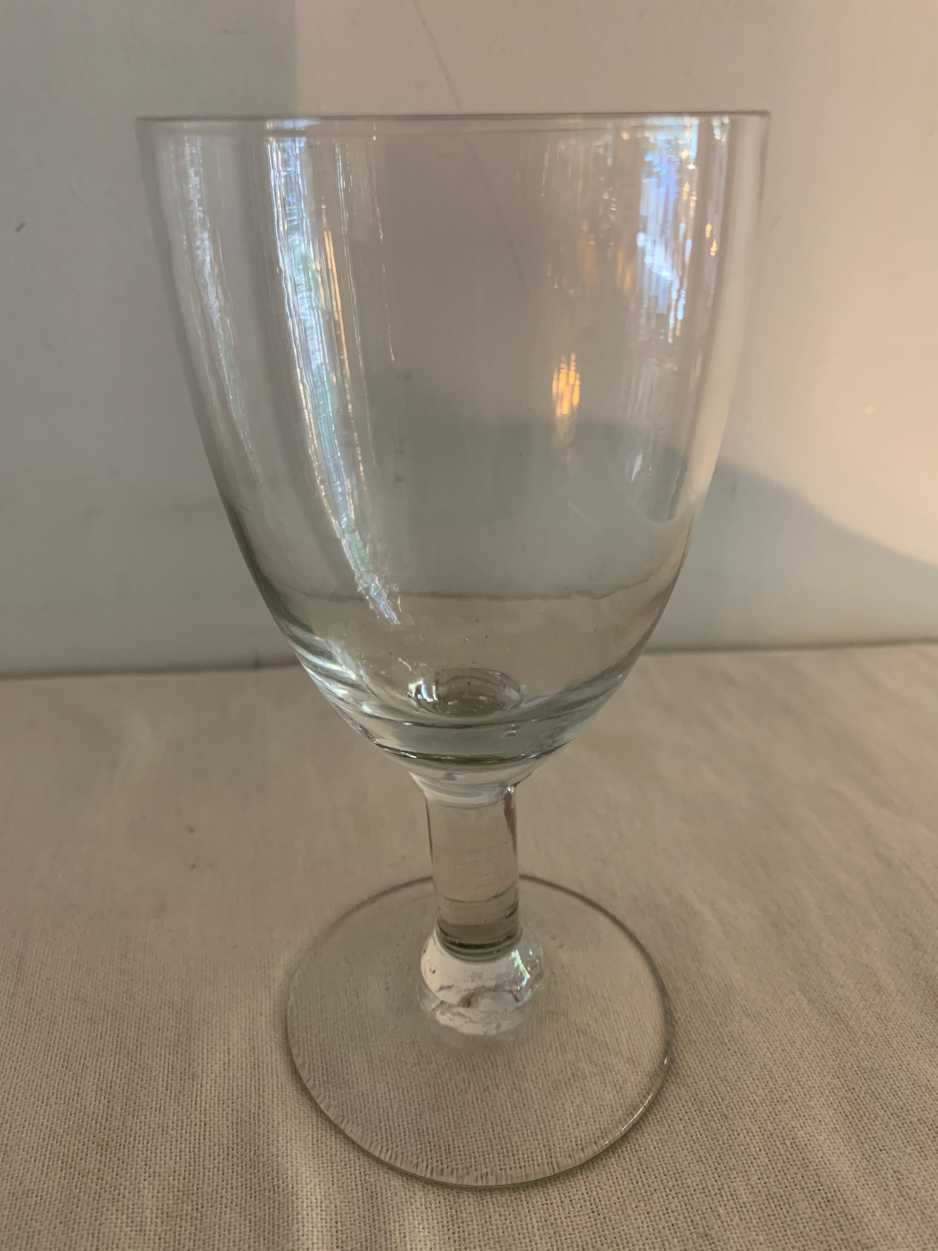 8 old blown and different foot wine glasses