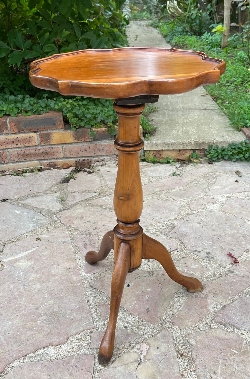 Small wooden pedestal table