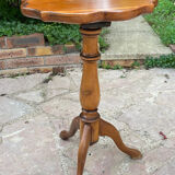 Small wooden pedestal table