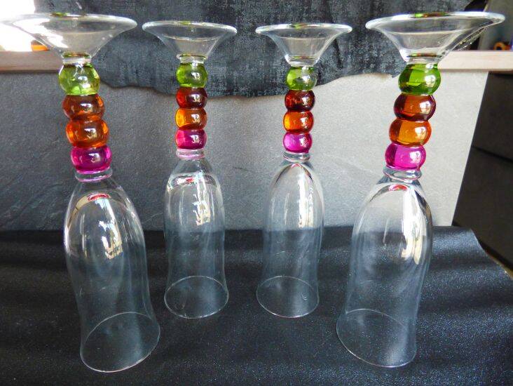 4 vintage flutes with coloured glass stems