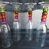 4 vintage flutes with coloured glass stems