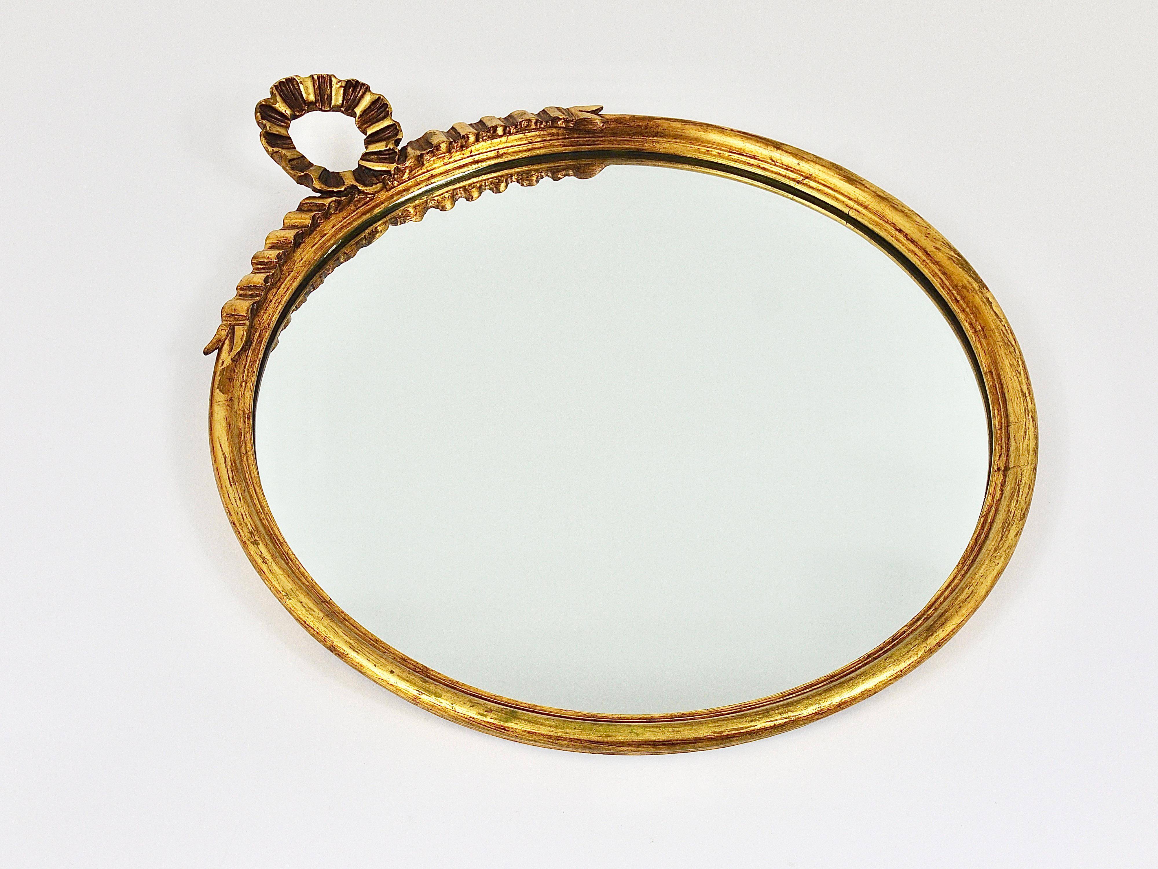 Round wall mirror in gilded wood, mid-century, C. Allodi & G. Subelli, Italy, 1950s.