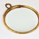 Round wall mirror in gilded wood, mid-century, C. Allodi & G. Subelli, Italy, 1950s.