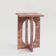Bond side table in red travertine