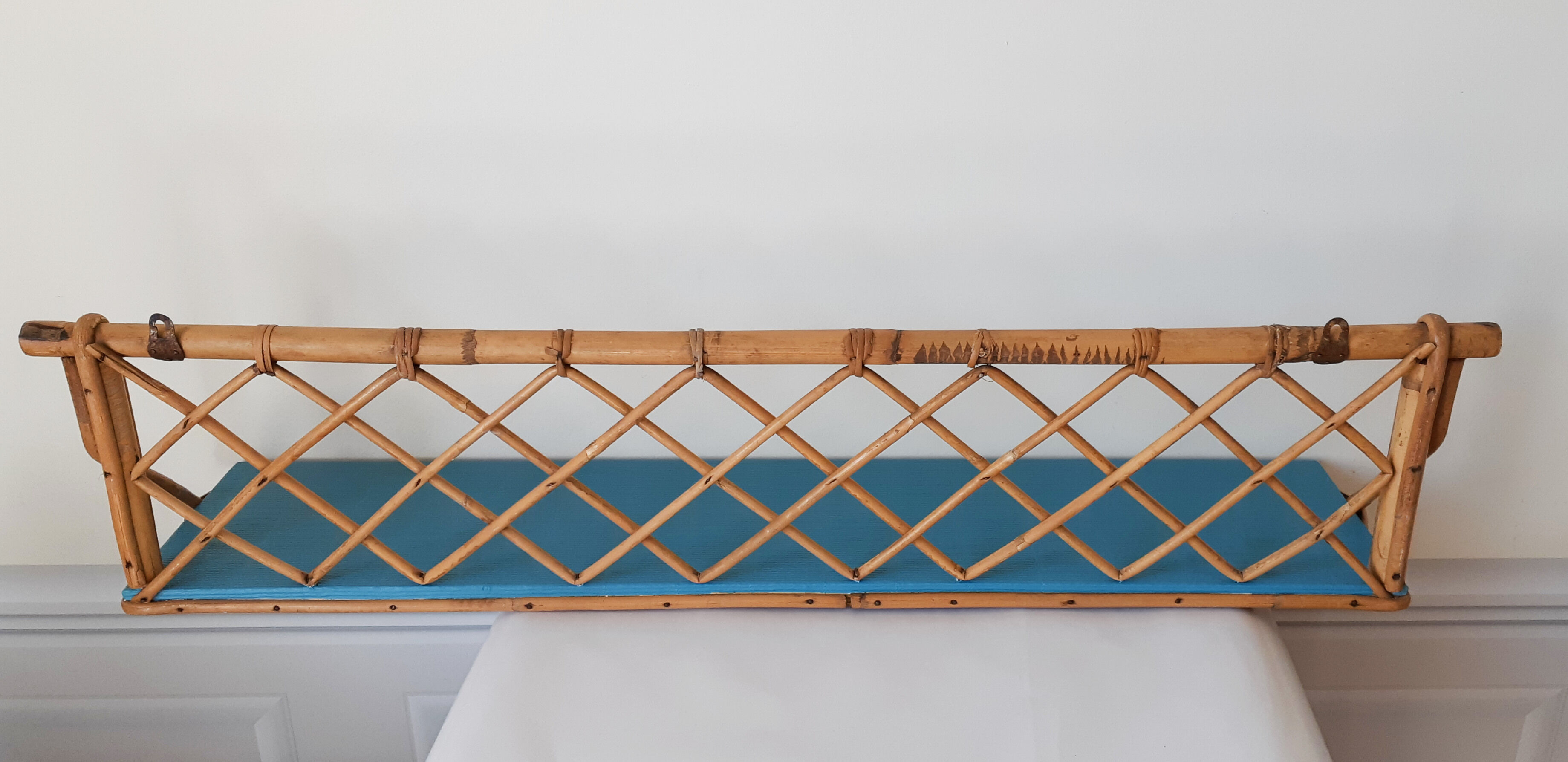 Blue rattan shelf
