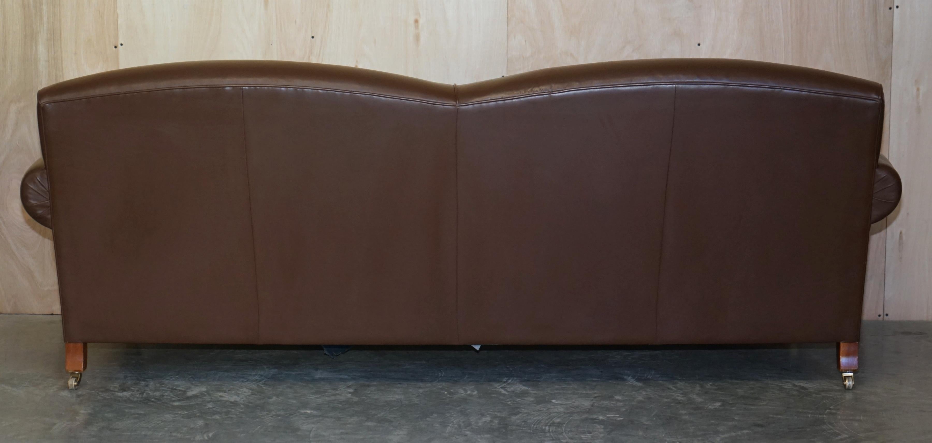 Contemporary Howard & Sons style grand sofa with brass casters.