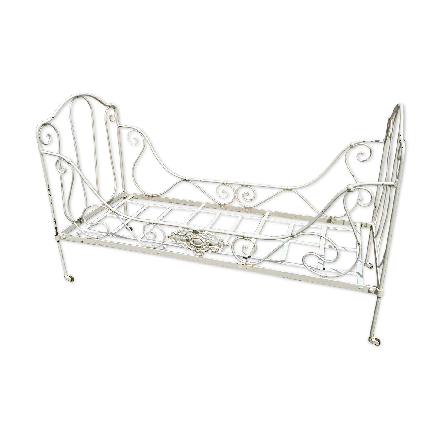 Ancient white metal bed