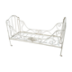 Ancient white metal bed