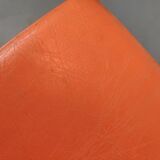 Old swivel orange sitting dentist stool