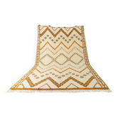 Tapis berbère XXL avec de longues franges des années 1960. Pile couleur crème avec des motifs dans des tons orange et vert.