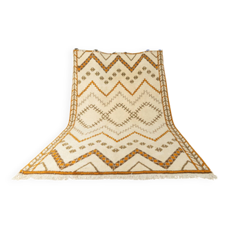 XXL Berber rug with long fringes from the 1960s. Cream-coloured pile with patterns in orange and green tones.