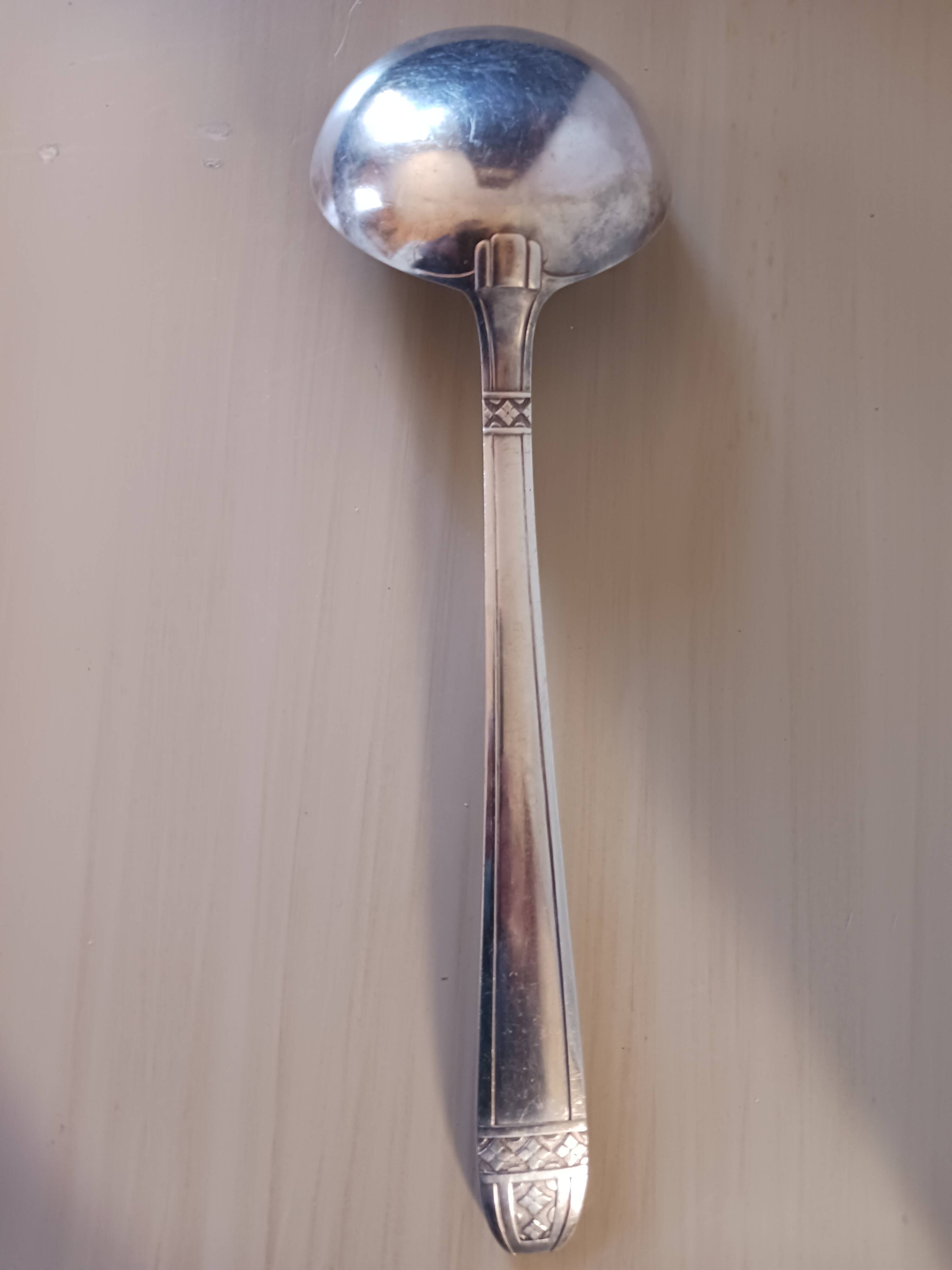 Silver-plated metal ladle, art deco motif.