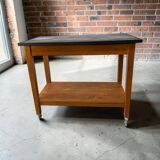 Vintage wooden high table on wheels