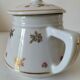 Porcelain teapot Louis Lourioux, decorated with roses and pyroluxe gilding.