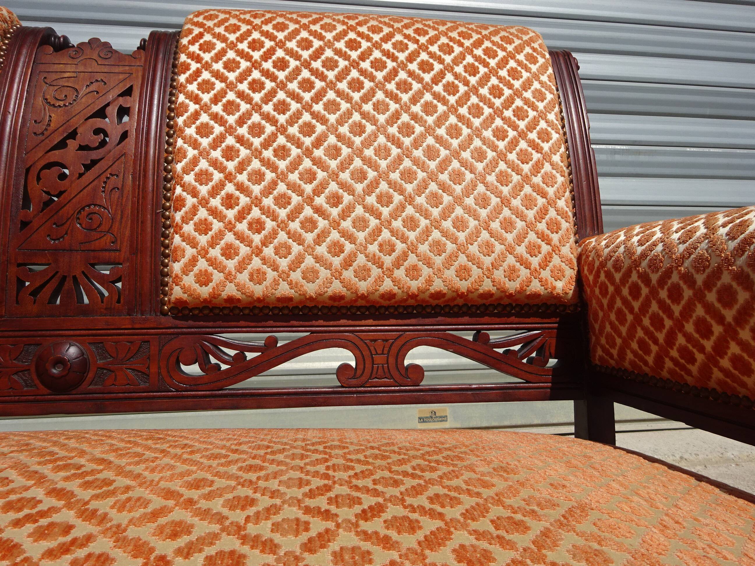 Old bench in wood and orange velvet