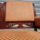 Old bench in wood and orange velvet