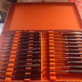 Set of 12 forks and 11 dessert knives from the 1950s. Wooden handles and box.