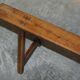 Pair of antique Victorian trestle benches in fruitwood.