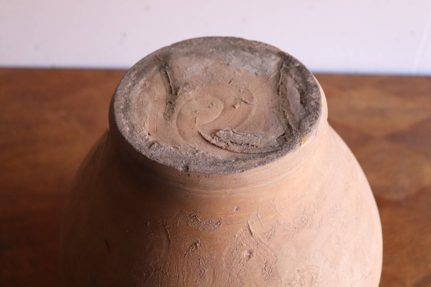 Old glazed terracotta olive jar