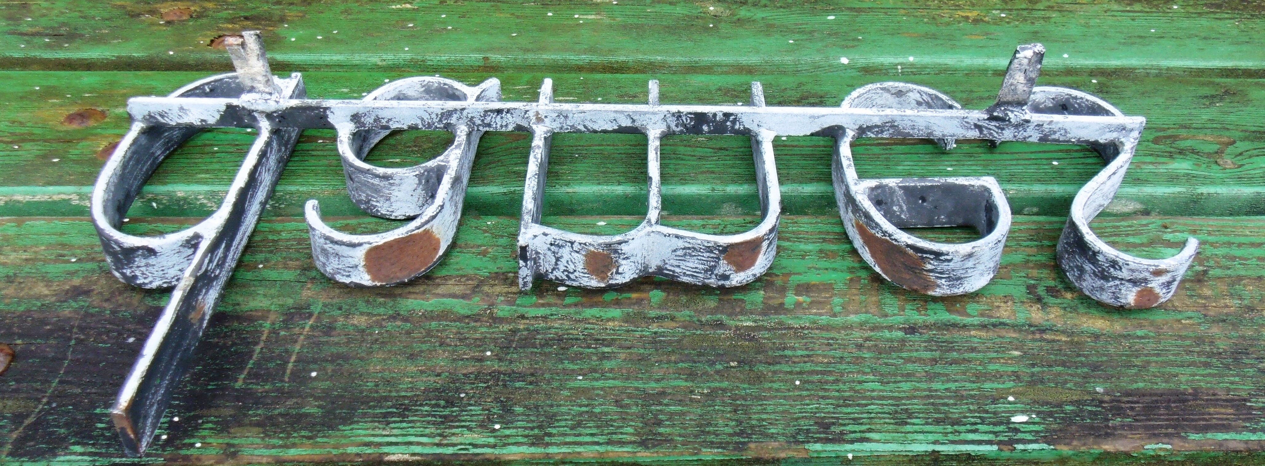 Former hairdresser sign "dames" in metal