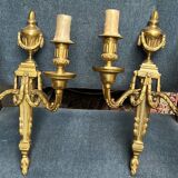 Pair of wall lights. Solid gilded bronze.