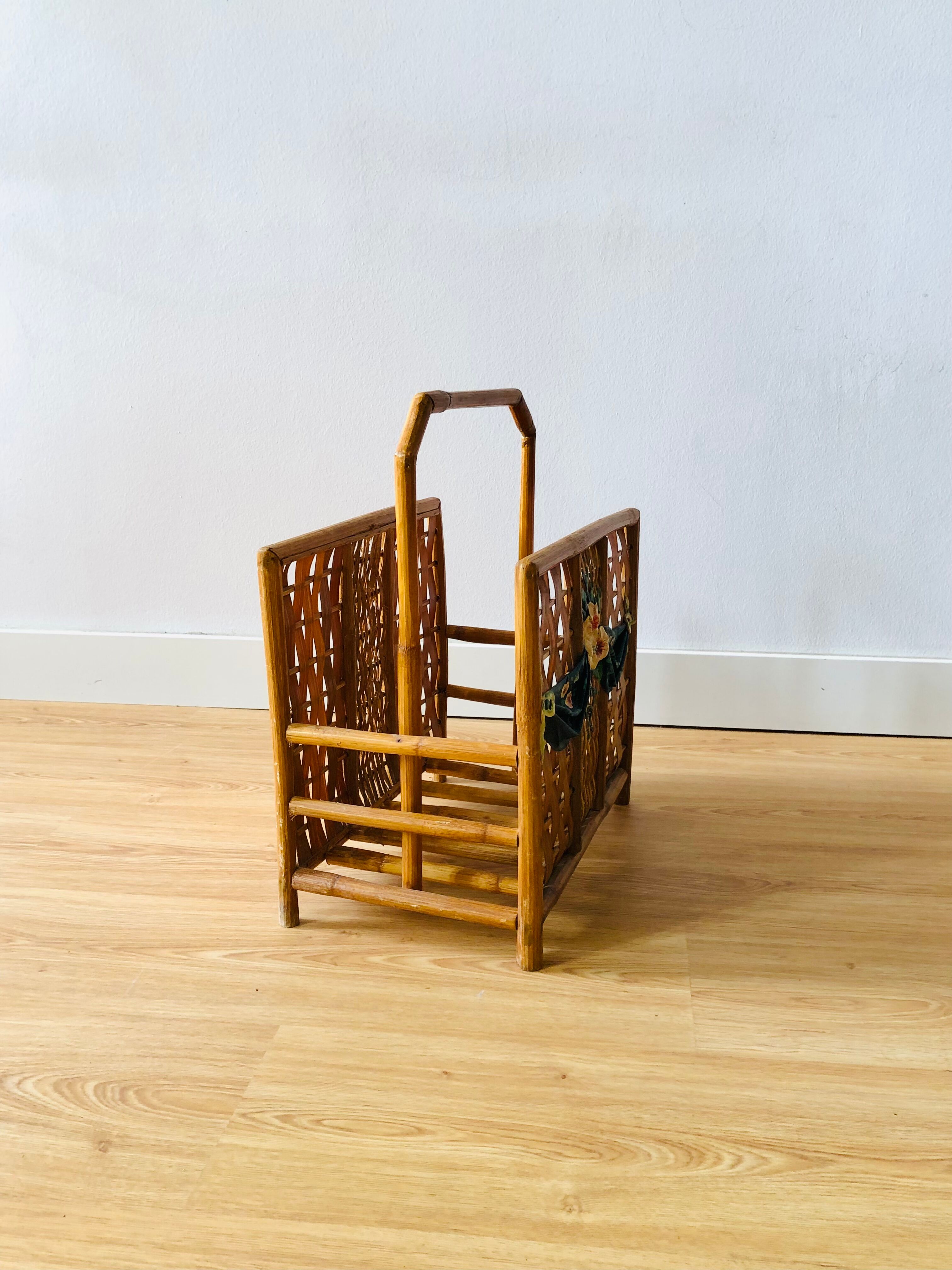 Vintage rattan magazine holder with floral decoration