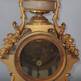 19th century clock in gilded bronze and alabaster