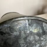 Old garden pitcher vase in folded zinc