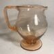 Pink pitcher in bubble glass