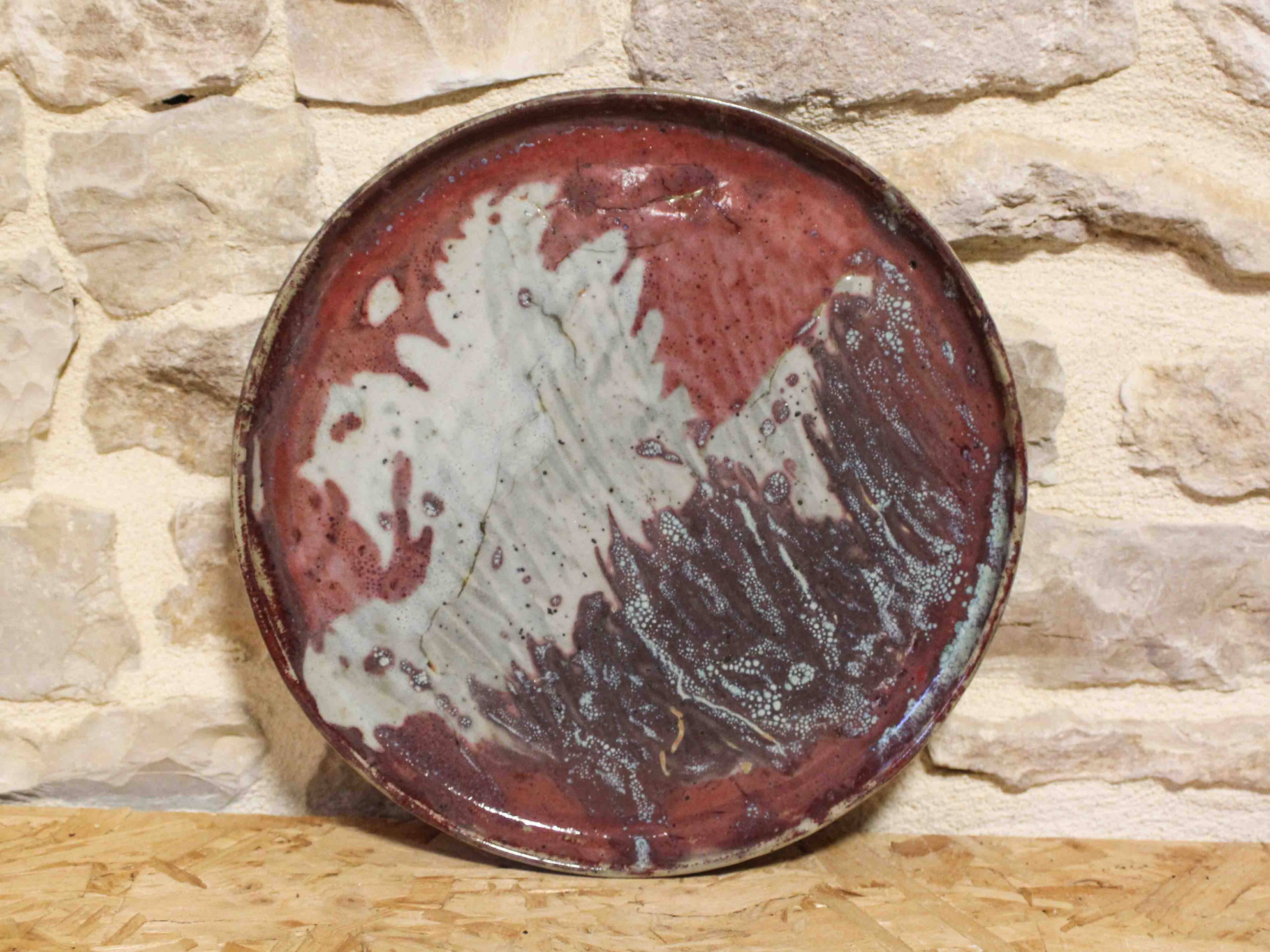 Large decorative plate in glazed stoneware, signed.