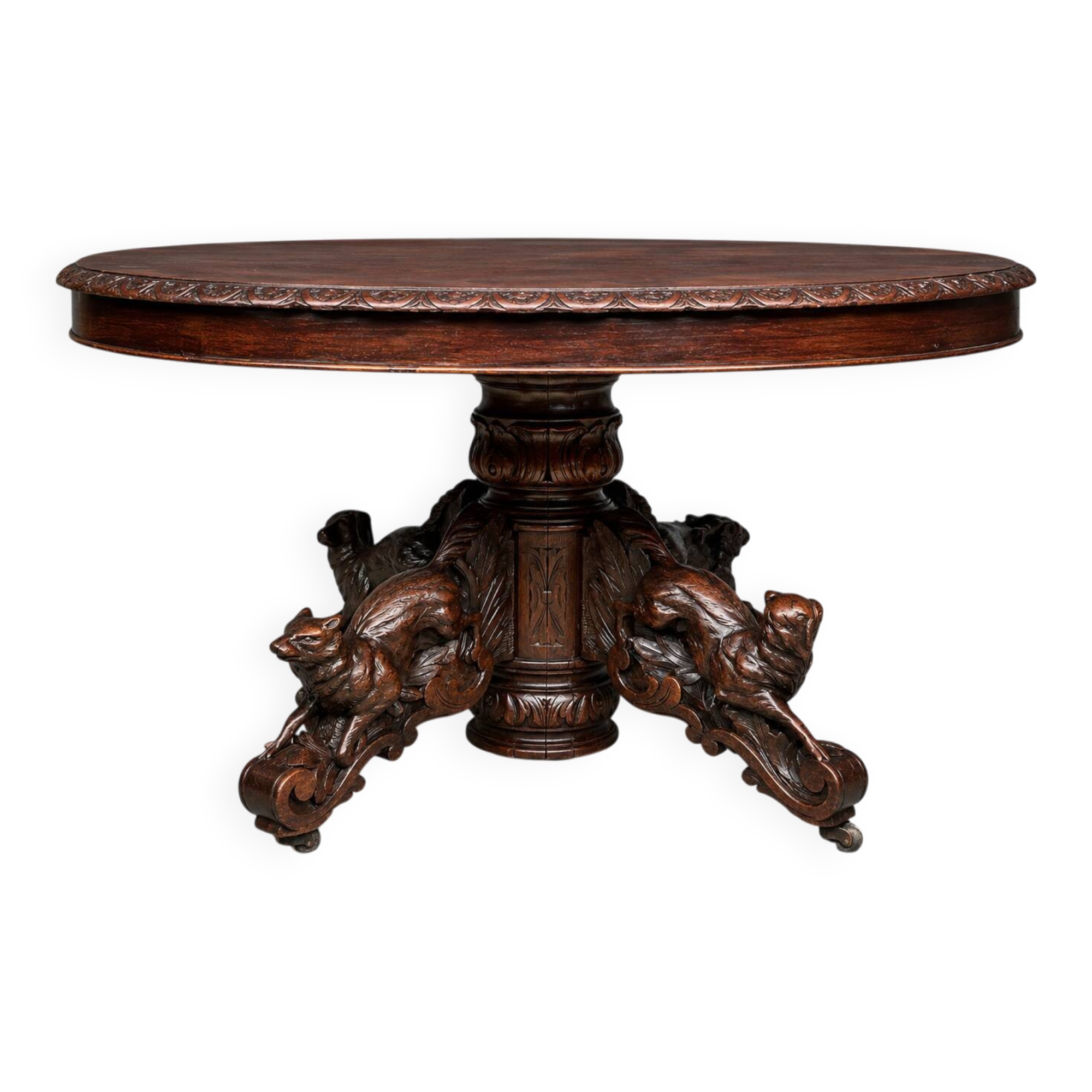 Hunting style dining table with figures of four different animals.