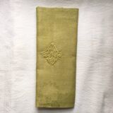 Old embroidered green square table napkin with cutwork