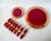 set of trivets, bottle coasters and knife holders in art de cherry-colored ceramic