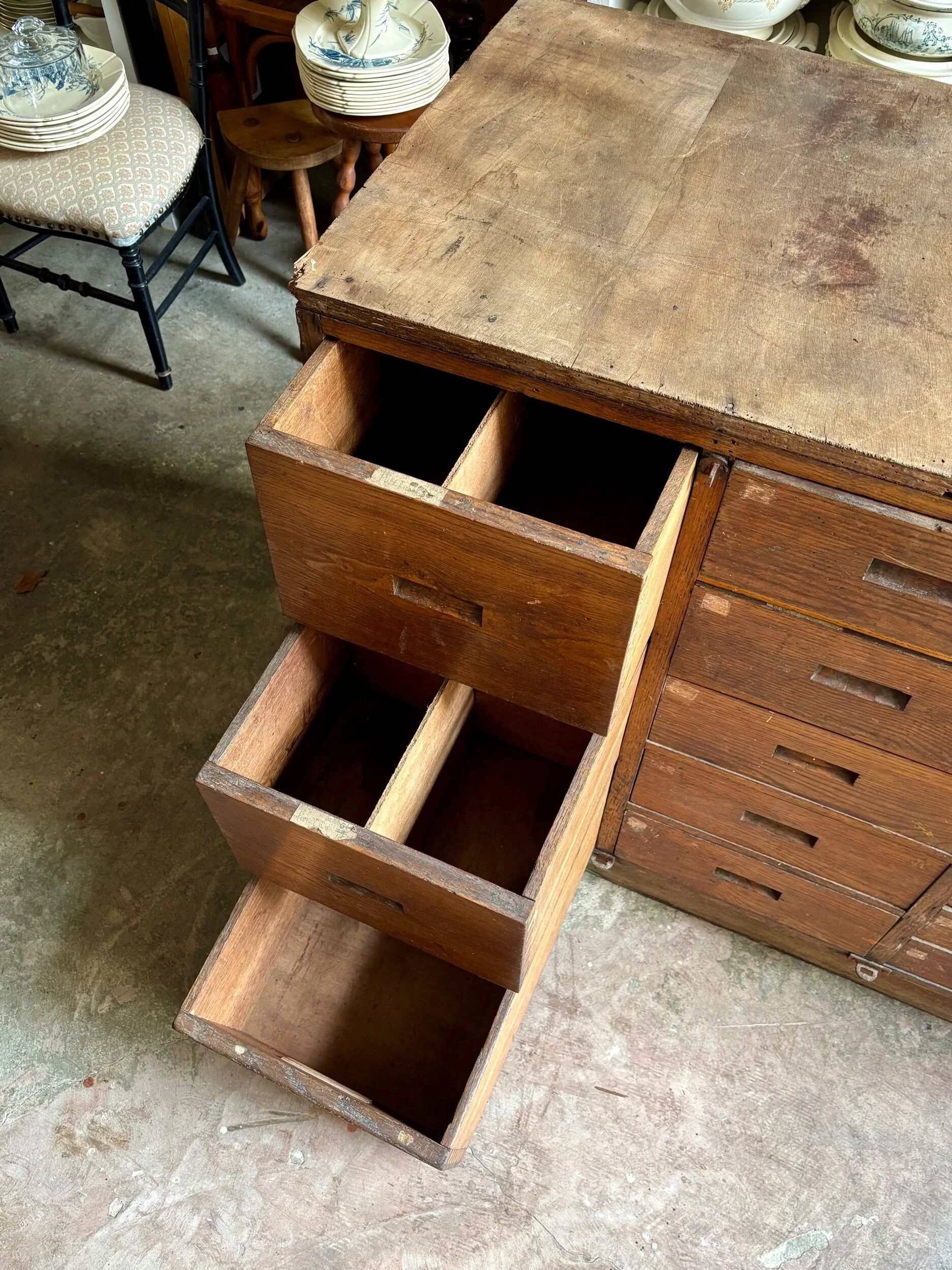 Craftsman's cabinet with 16 drawers in dark wood.